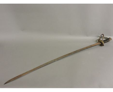 A French cavalry officer's sabre, with brass hilt, no scabbard, blade engraved with an armoured helmet, 104cm long
