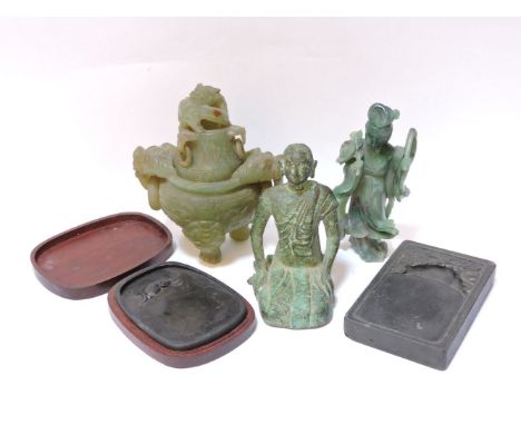 Two Chinese ink stones, a naively carved hardstone sensor, a jade carving of a female deity, and a cast figure of a monk