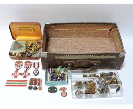 A collection of military cap badges, 'The Buffs', PTI instructor, a group of three miniatures, together with First Aid and Br