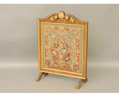A gilt and walnut firescreen, in the style of William Kent, 90.5cm high
