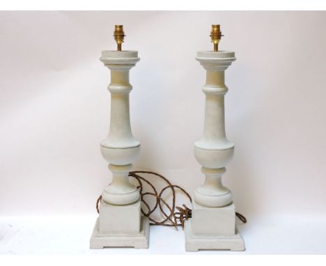 A pair of grey painted turned table lamp bases, 66cm tall