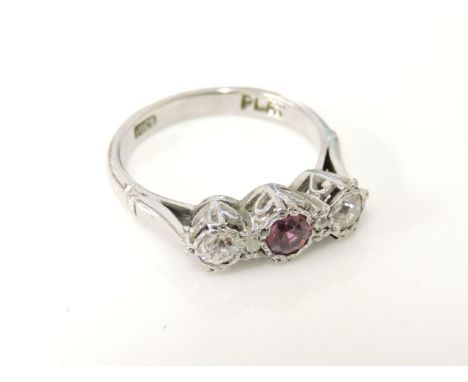 A three stone ruby and diamond ring, with a pair of diamond points, marked plat and 18ct, 3.5g