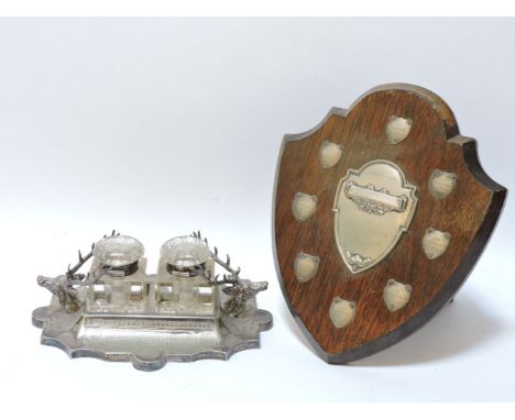 A Victorian silver plated double inkwell, with stags' heads, inscribed, 23cm, and a motorcycle Claude Scott trophy shield, 28