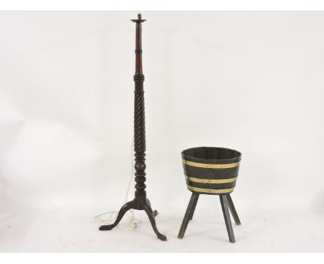 A turned mahogany lamp standard, and a brass bound bucket