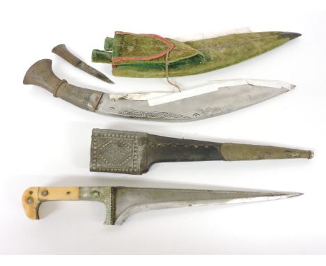 A kukri, with a felt scabbard, and an Arab dagger