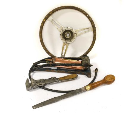 A Vintage Metal and Wooden Three-Spoke Steering Wheel, a Dunlop pump, a large adjustable spanner, and a large flat head screw