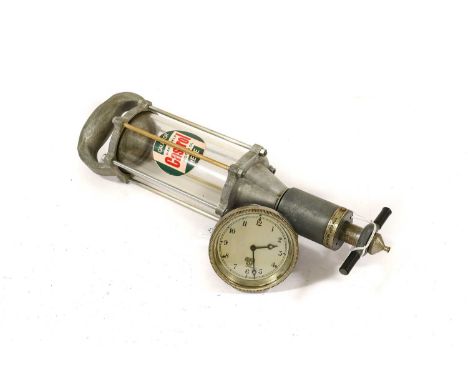 A Castrol Motor Oil Workshop Oil Dispenser, 40cm high, and a 1920's/30's Car Clock, stamped P-150.381, 9cm diameter (2)