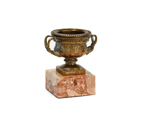 A 1920's/30's Brass Mascot, in the form of the Warwick Vase, the interior of the bowl stamped Registered design applied for G