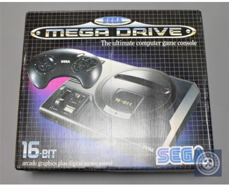 A Sega Mega Drive 16-Bit computer game console, boxed in retail condition.