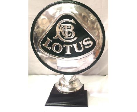 Cast metal Lotus sign on plinth, D: 38 cm. P&amp;P Group 3 (£25+VAT for the first lot and £5+VAT for subsequent lots) 