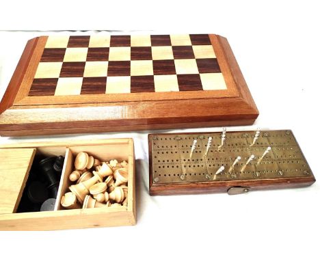 Folding wooden chess board containing a selection of non matching pieces, a boxed Staunton wooden chess set in box and a wood