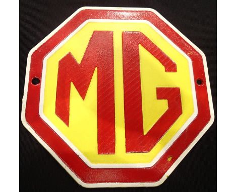 MG octagonal cast iron modern wall plaque, H: 24 cm. P&amp;P Group 2 (£18+VAT for the first lot and £3+VAT for subsequent lot