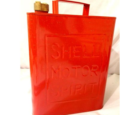 A weathered Shell oil petrol can in red with brass cap. P&amp;P Group 3 (£25+VAT for the first lot and £5+VAT for subsequent 