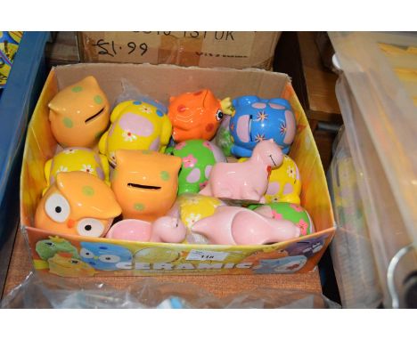 Quantity of ceramic money boxes in the shape of different animals and dinosaurs