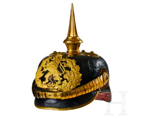 A helmet for Hessian Infantry Officers Beamte Black lacquered leather body; front visor with green underlay and rear visor wi