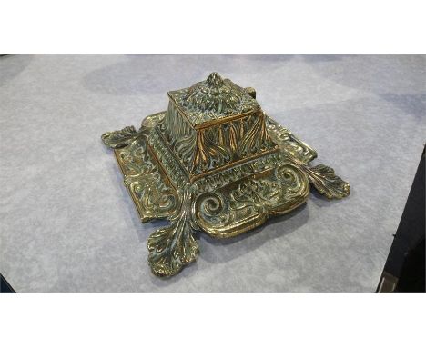 A brass inkwell