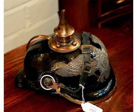 A reproduction World War I style pressed hid pickelhaube, with eagle helmet plate