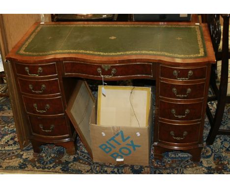 A circa 1930's figured walnut lady's pedestal writing desk, the serpentine top set with green leather gilt tooled scriber abo