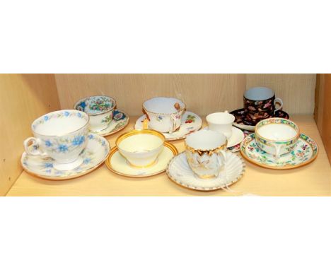 A collection of eight early/mid 20th century cabinet cups and saucers, various factories including Hammersley, Copeland, etc