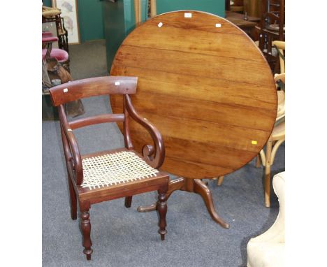 An early 19th century oak tripod table, the circular planked top on turned column and three swept legs, 100cm diameter, toget