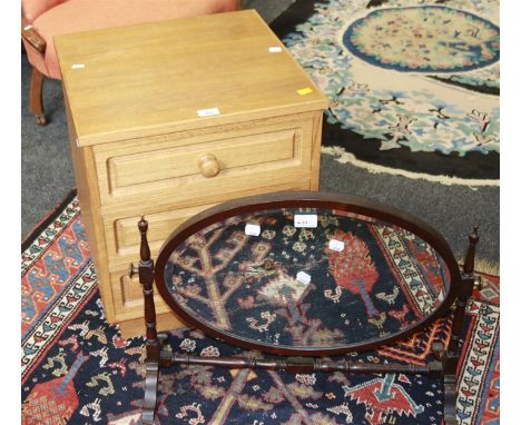 An Edwardian mahogany skeleton toilet mirror, and a light oak three drawer chest