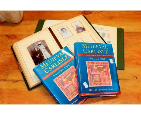 An Edwardian portrait photograph album, an album of Botswana and Lesotho stamps, and two volumes of Medieval Carlisle by Summ