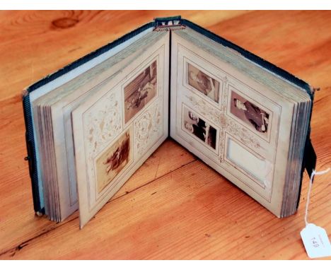 A leather bound Edwardian visiting card album, containing various period portrait photographs