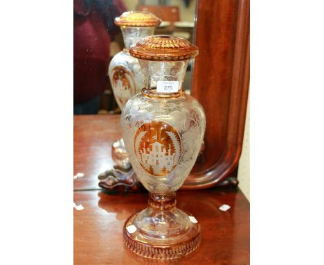 A late 19th/early 20th century Bohemian amber and clear glass table lamp, of vase form, etched with fruiting vines around twi