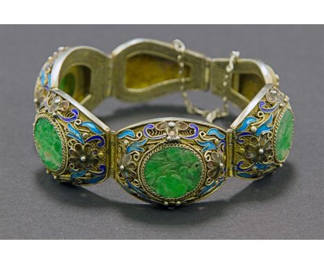 A jade and champlevé enamel bracelet, of four circular engraved jade plaques within hinged oval panels with filigrée work, po