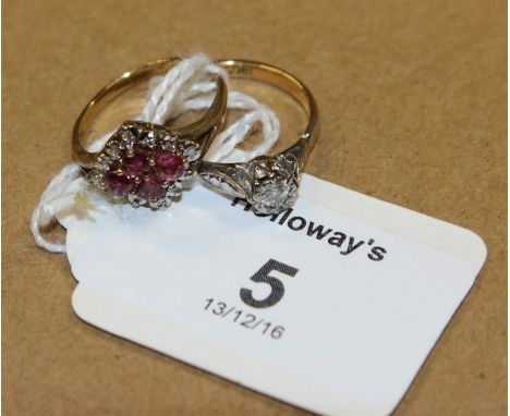 A ruby and diamond lozenge-shaped cluster ring, with four raised circular cut diamonds to centre within a border of single cu