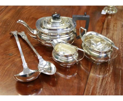 A King's pattern silver plated soup ladle, and basting spoon, a silver plated three piece tea service and five serviette ring