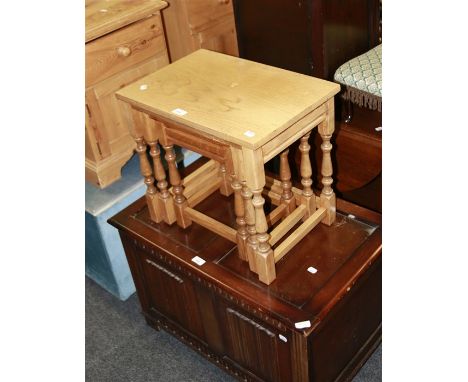 A light oak nest of three stools, and a reproduction two panel coffer