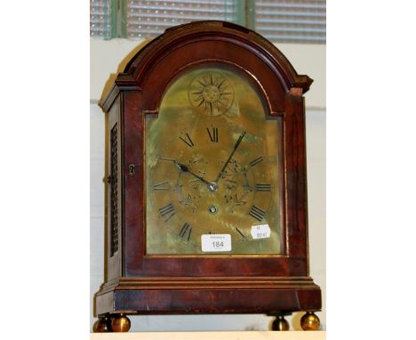 A late 18th century/early 19th century mahogany bracket clock, the arched case with brass plain scroll handle enclosing a sin