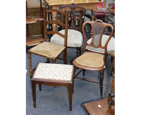 A pair of Edwardian bedroom chairs, with incise carved rails, a rush seated ladder back chair, a cane upholstered bedroom cha