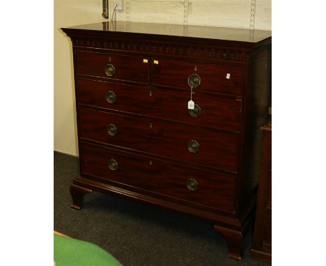 The top section from a George III mahogany chest on chest, having moulded cornice arcaded, drop finial frieze over two short 