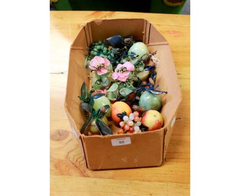 A collection of carved jade, and other hardstone fruit and berries