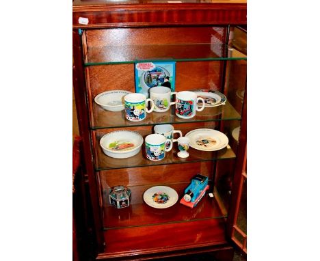 A collection of Wedgwood Thomas The Tank Engine tableware, and other items, including money boxes, plates, mugs, egg cup etc