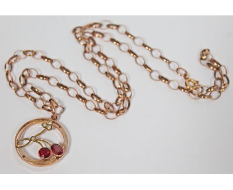 A gold pendant set with ruby coloured stones and half cut pearls, marked '9ct', diam. 2.2cm, on hallmarked 9ct gold chain, le