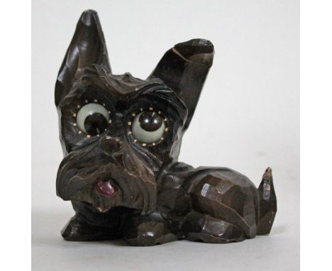 A German Oswald novelty mantel clock formed as a dog with rolling eyes for minute and hour hands, height 14cm. Condition - re