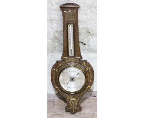 An Edwardian Art Nouveau style mother of pearl and brass inlaid aneroid barometer, length 88cm.