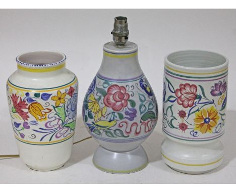 Three pieces of Poole pottery comprising two vases and a lamp base, height 22cm, 23cm & 30cm.
