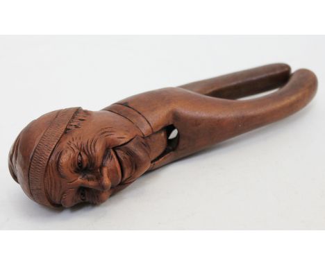 A novelty nut cracker, length 22cm.