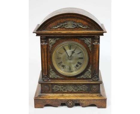 A domed top oak mantel clock circa 1900 with silvered brass dial and gilt metal mounts, the movement stamped 'W&H Sch', heigh