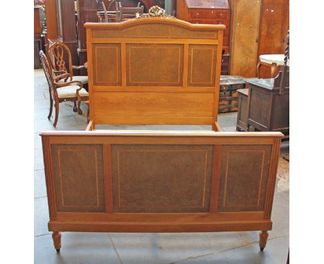 A Continental light oak double bed frame having gilt metal bow and ribbon mount, tulip and ebony crossbanded bird's eye maple