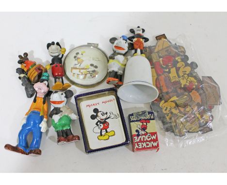 A quantity of Mickey Mouse items including a bell, cereal box cut outs, playing cards etc.