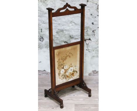 An Edwardian mahogany fire screen with adjustable needlework panel, height 117cm.