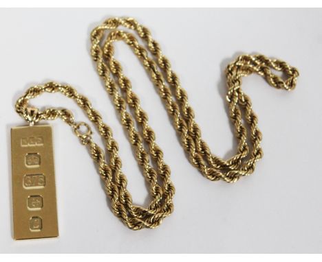 A hallmarked 9ct gold ingot pendant on chain marked '9ct', length 76cm, gross wt. 97.3g.