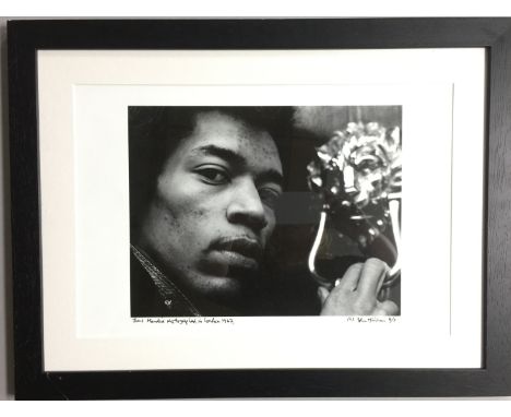 JIMI HENDRIX FRAMED PRINT - Super framed print of a shot of Jimi in London, 1967 taken by John Minihan. Signed and inscribed 