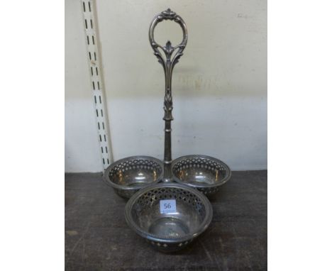 A Victorian silver plate wine bottle holder