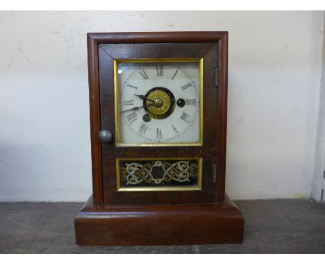 A 19th Century American beech shelf clock